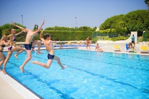 Outdoor pool, open 9:00 AM to 7:00 PM, pool umbrellas, pool loungers