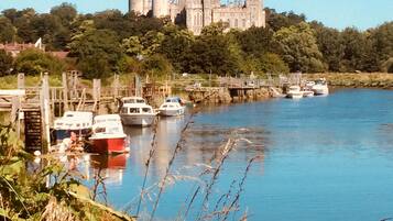 Perched on a hill, this historic castle offers serene views of the surrounding lush greenery and tranquil river.