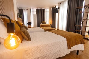 Family Room, Private Bathroom (4) | Blackout drapes, iron/ironing board, free WiFi, bed sheets