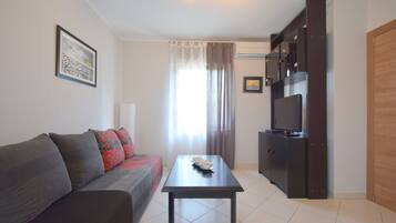Classic Apartment, 1 Bedroom | Living room | Flat-screen TV
