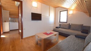 Appartement, 1 chambre, patio | Salle de séjour