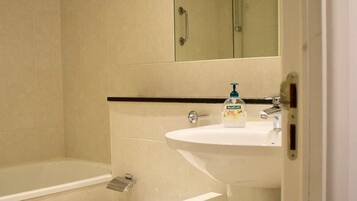 Apartment (1 Bedroom) | Bathroom | Hair dryer, towels, soap, shampoo