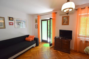 Family House, 4 Bedrooms | Living area | Flat-screen TV