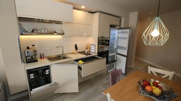 Luxury Apartment, Balcony, City View | Private kitchen | Full-sized fridge, microwave, oven, stovetop