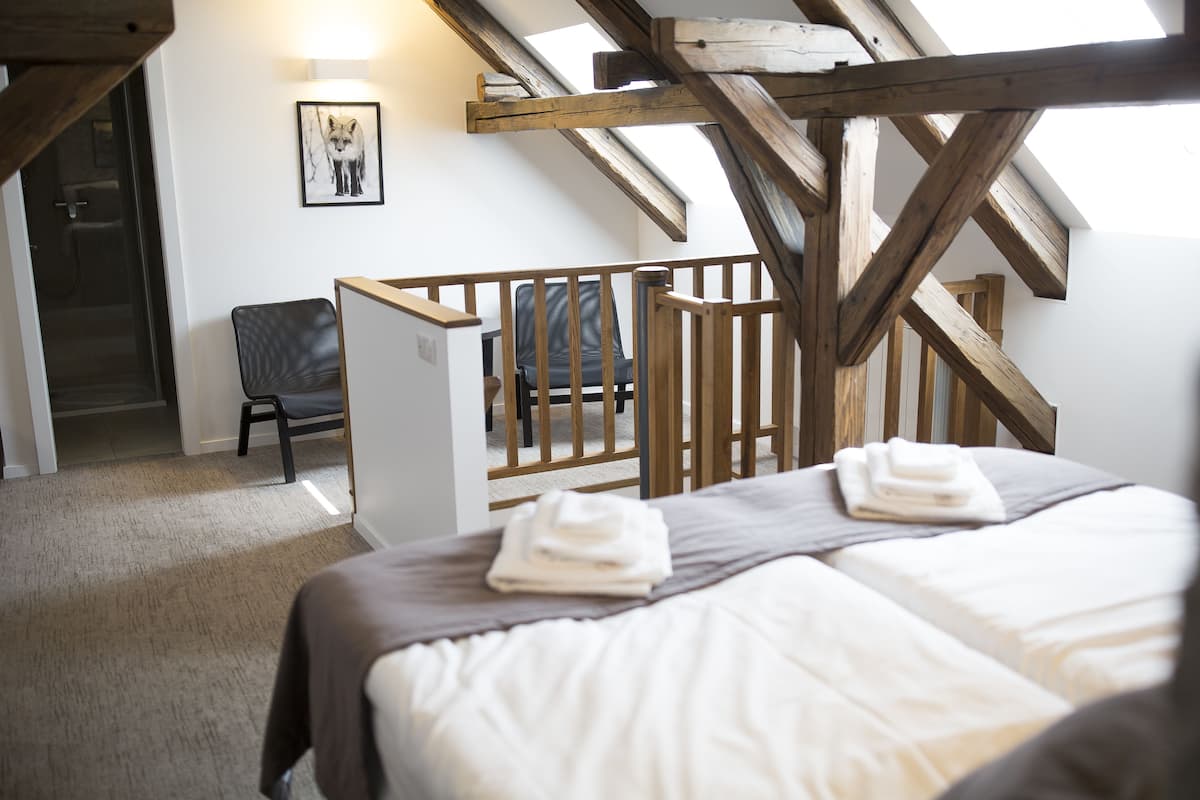 standard room (mezonet) | minibar, in-room safe, individually decorated, desk