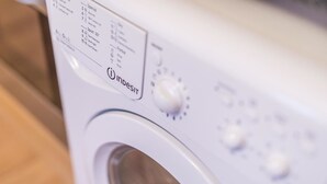 A white washing machine with a control panel displaying various settings. - North Circular Studios 4 (Dublin)