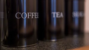 Three black containers with labels on a countertop. - North Circular Studios 4 (Dublin)