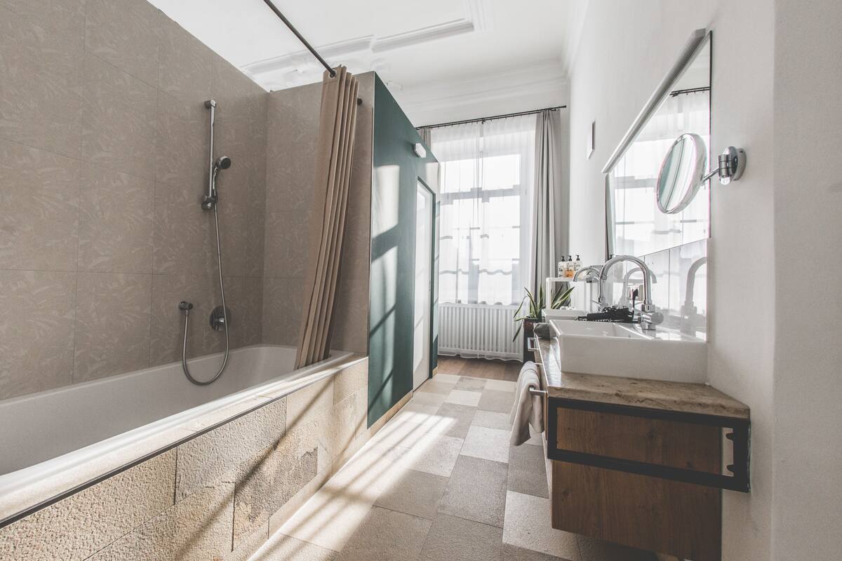 signature double room | bathroom | deep-soaking bathtub, hair dryer, bathrobes, towels