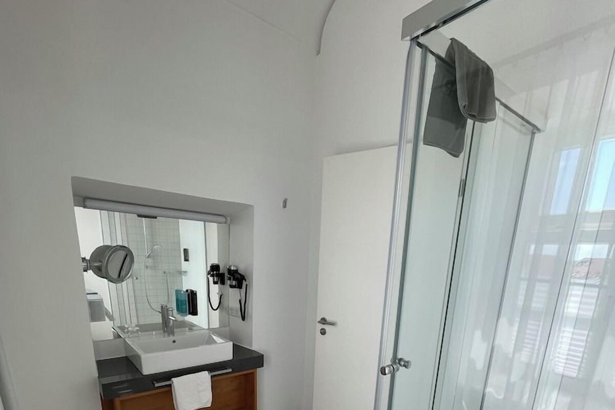 Bathroom | Deep soaking tub, hair dryer, bathrobes, towels