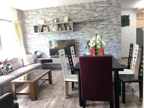 Family Apartment, Multiple Beds, Non Smoking | Living room | Flat-screen TV - Hostel Familia (Osaka)