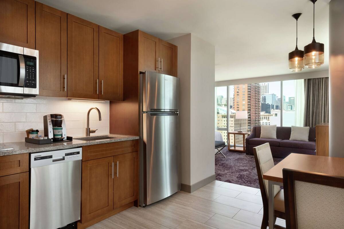 studio, 1 king bed, corner | private kitchen | full-sized fridge, microwave, stovetop, dishwasher