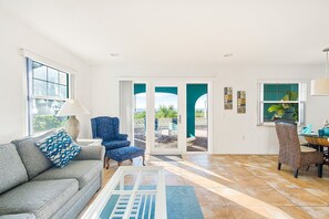 55-inch flat-screen TV with cable channels, TV - Escape Coastal Resort on Casey Key (Nokomis)