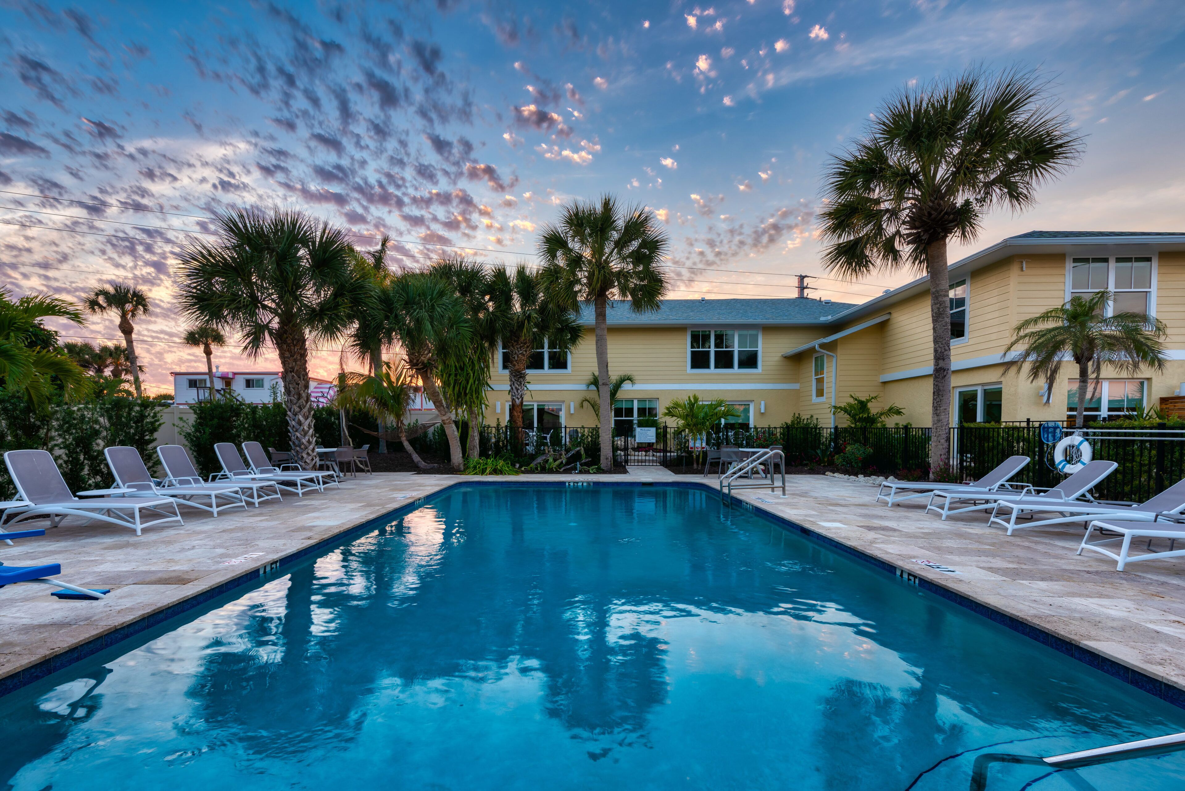 outdoor pool, open 7:00 am to 8:00 pm, pool umbrellas, pool loungers