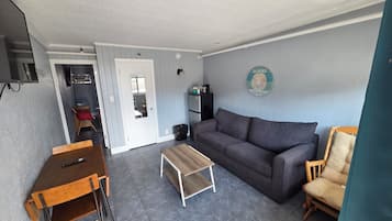 Deluxe suite, 1 kingsize bed met slaapbank, niet-roken | Woonruimte