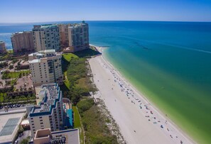 On the beach, sun-loungers, beach umbrellas, beach towels