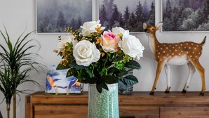 A vase with white and pink roses on a wooden table. - Olinda Two Bedroom Apartment B2 - This beautiful and comfortably furnished apartment is centrally located in the village of Olinda. (Olinda)