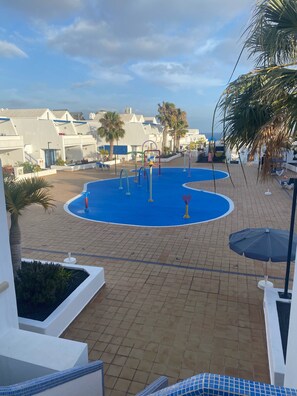 A pool area with exercise equipment, palm trees, and a view of the sea. - 2 Heated Communal Pools and a splash pool with Sea Views (Tías)