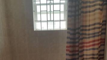 Standard Apartment, 2 Bedrooms, Shared Bathroom | Bathroom | Shower, rainfall showerhead, free toiletries, towels