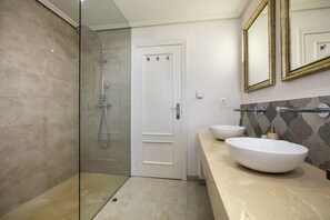 Shower, hair dryer, towels, toilet paper