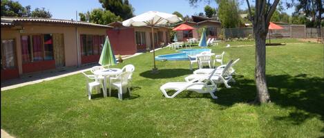 Outdoor pool, open 10:00 AM to 10:00 PM, pool loungers