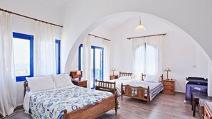 A bedroom with two wooden beds, a desk, and a chair. - Villa Mandola Rosa: Elegantly decorated, sea views, pool, A/C (Prodromi Latchi)