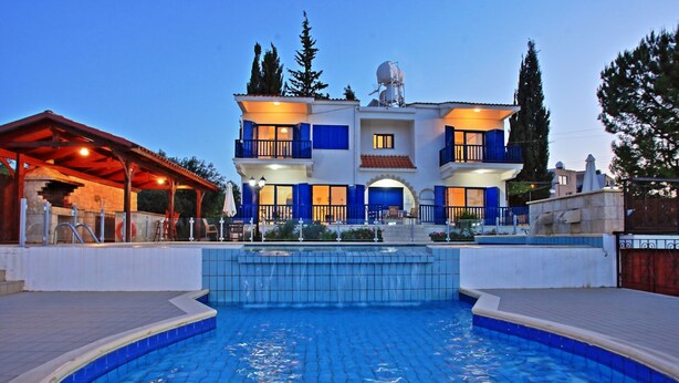 A two-story building with a swimming pool in front. - Villa Mandola Rosa: Elegantly decorated, sea views, pool, A/C (Prodromi Latchi)