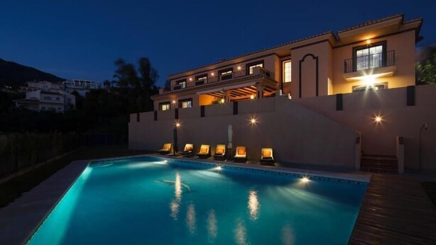 A two-story house with a swimming pool, multiple balconies, and outdoor lighting. - Luxury Villa near to Mijas Pueblo that sleeps 14. With Large Private Heated Pool (Mijas)