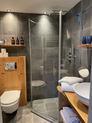 Shower, hair dryer, towels, soap