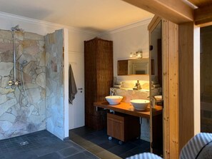 Bathtub, hair dryer, towels, soap