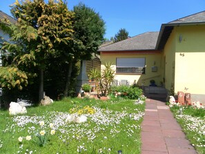 Stroll through the beautifully maintained garden and enjoy the serene atmosphere of this charming home.