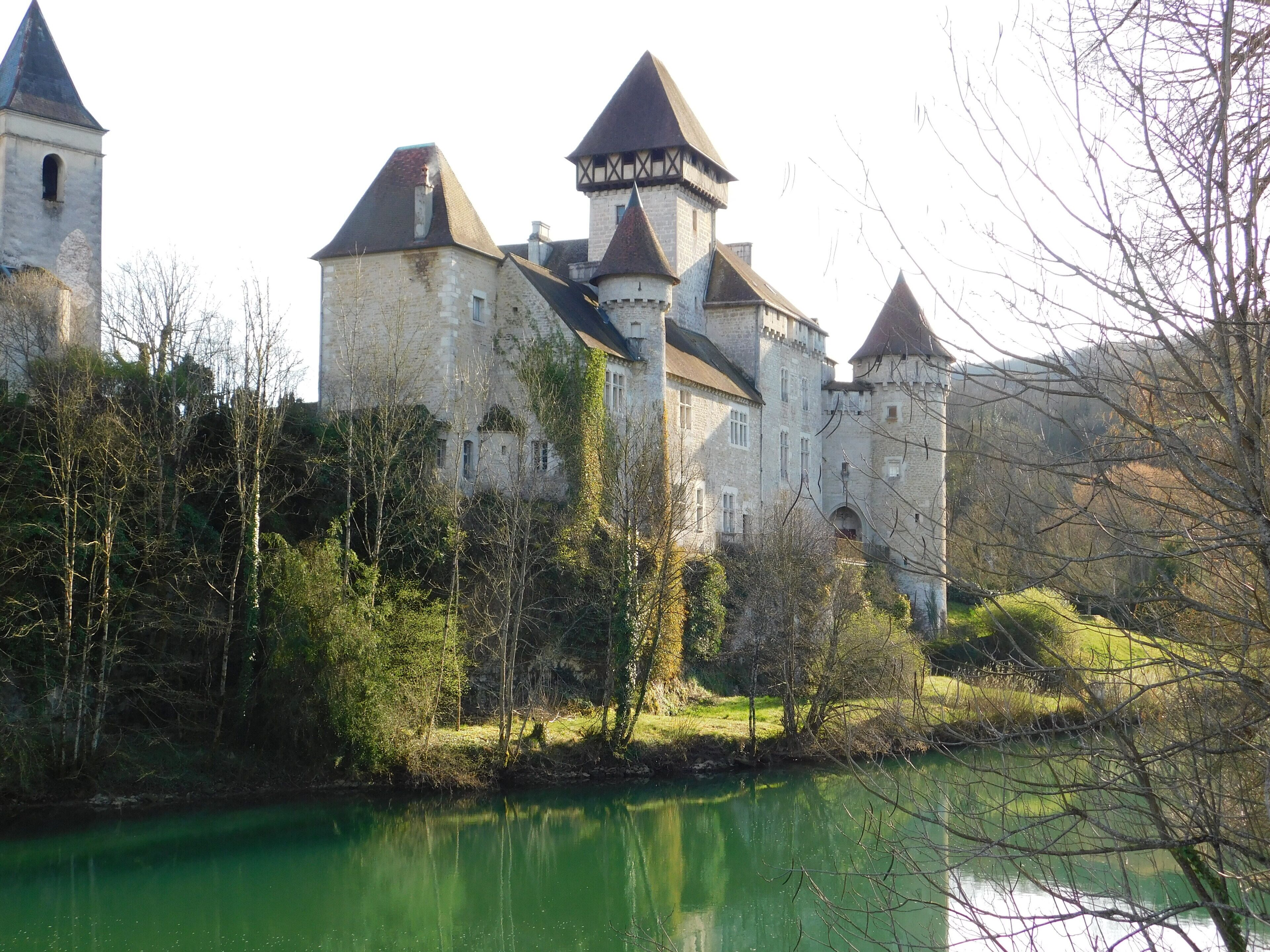 A historic castle with multiple towers and a moat.