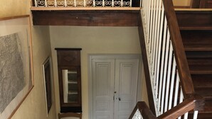 A wooden staircase with a white railing leading to a landing. - Corsican house perfect for hot weather between Monte Cinto and Calacuccia Lake  (LOZZI)