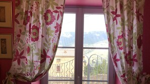 A room with a sliding glass door leading to a balcony with a metal railing. - Corsican house perfect for hot weather between Monte Cinto and Calacuccia Lake  (LOZZI)