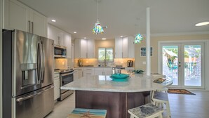 A modern kitchen with stainless steel appliances, a large island, and pendant lighting. - Paradise Bay - 4 Bedrooms [with 2 Master Suites] & 4 Bathrooms - sleeps 10 (Marathon)