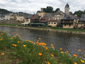 A riverside view with historic buildings and a church tower. - Views, air conditioned, heated pool, chefs kitchen,Saturday check-in out (Plazac)