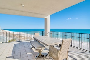 Enjoy ocean views from this outdoor space with a table, chairs, and bench.