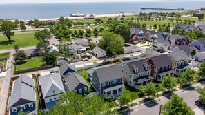 A residential area with houses, a park, and a pier by the sea. - Big, Beautiful & Beachside Bliss - Sleeps 10! (Hampton)