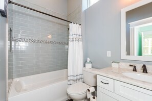 Combined shower/tub, hair dryer, towels, soap