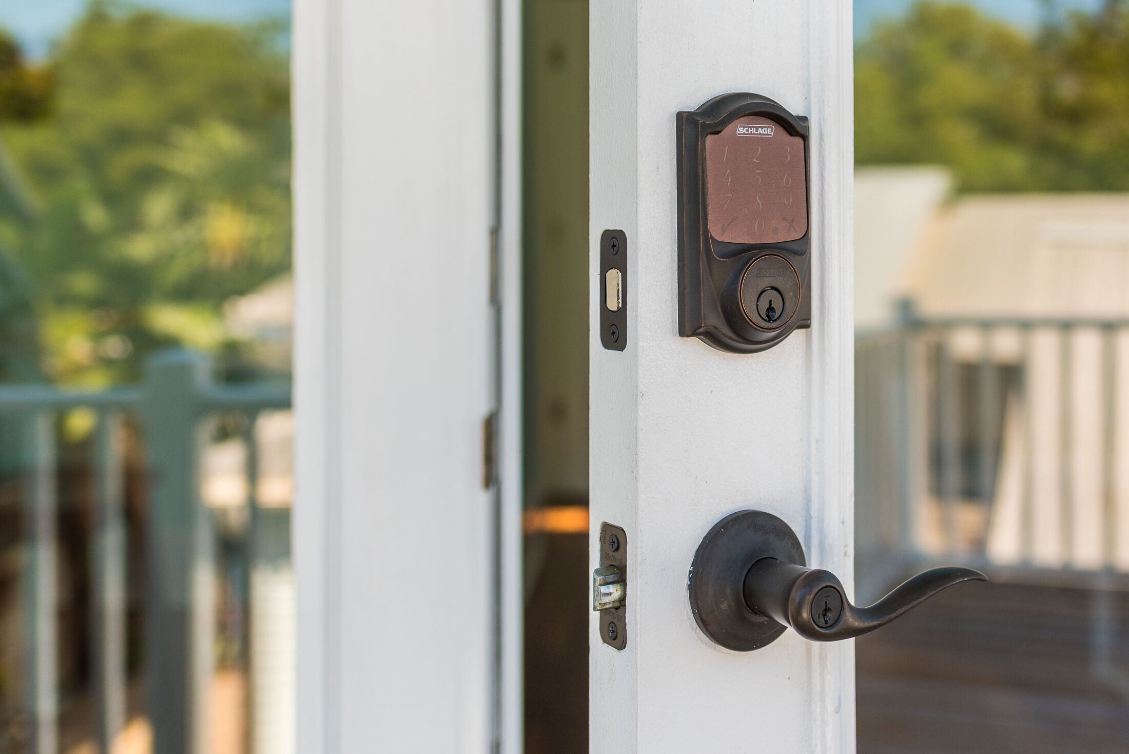 A door with a keyhole, a lock, and a Schlage brand lockset.