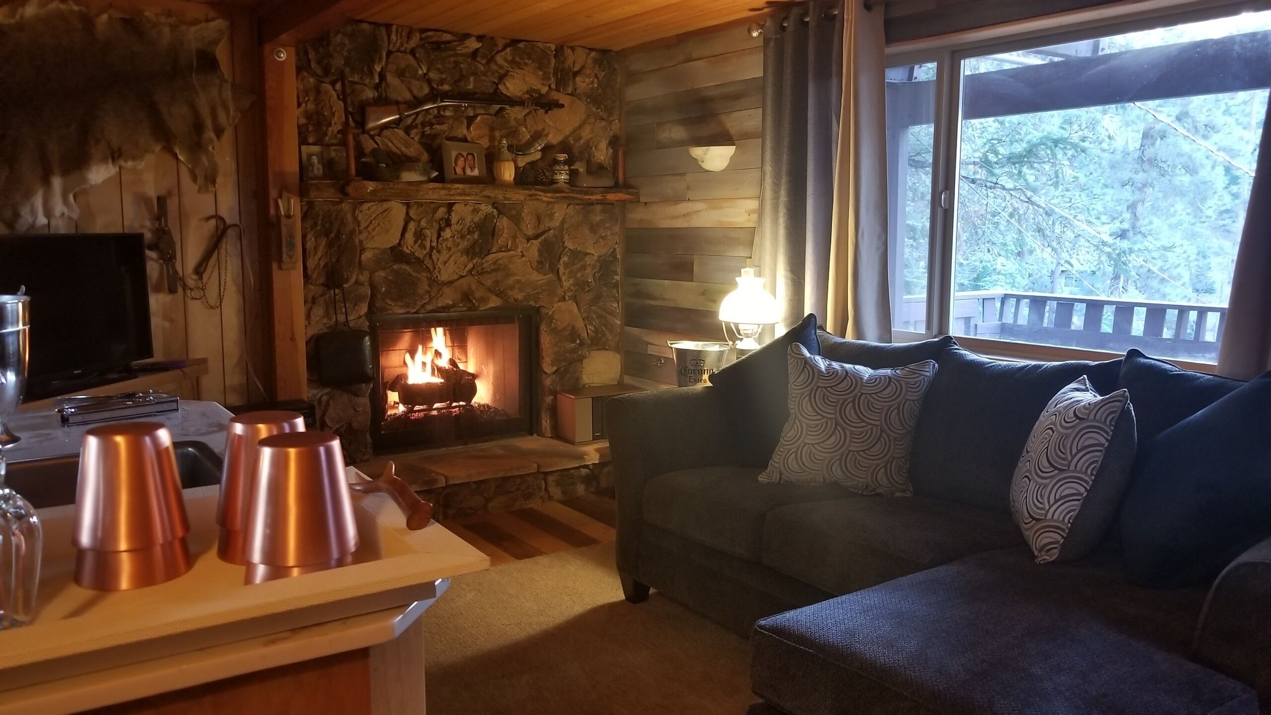 Groundfloor living area has a gas fireplace/wetbar/smart t.v./vintage artifacts