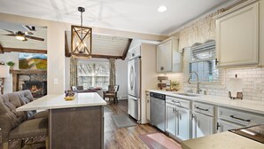A modern kitchen with a central island, stainless steel appliances, and a farmhouse-style ceiling. - Great Location/100 yd. to lift, Club Member, Walk To Resort & Fire pit!  (Beech Mountain)