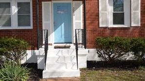 A brick house with a blue door, white shutters, and a small front porch. - 2BR 1BATH Cozy Cottage Quiet Area! 12mins-Downtown Nashville 10mins-Brentwood! (Nashville)