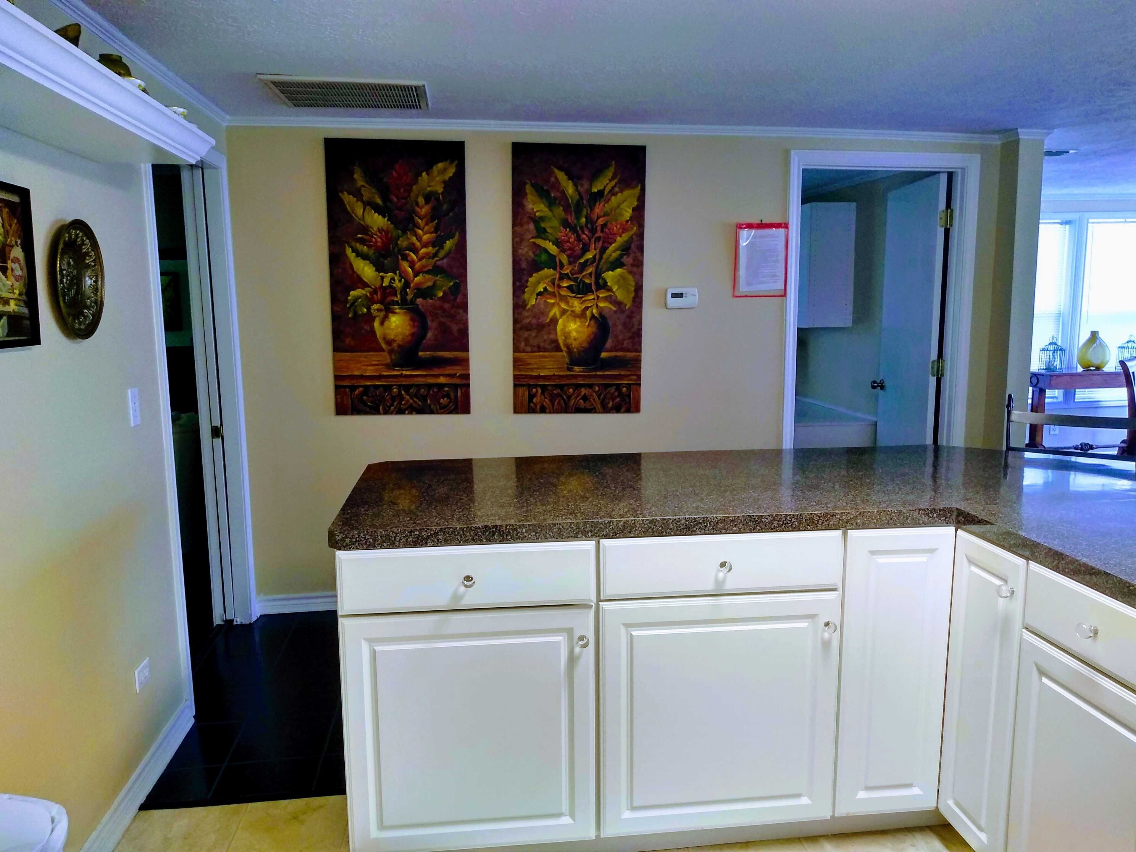 Kitchen view of door to both bedrooms