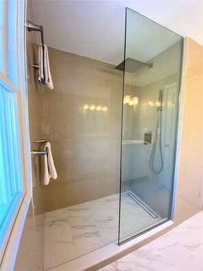 Shower, hair dryer, towels, soap