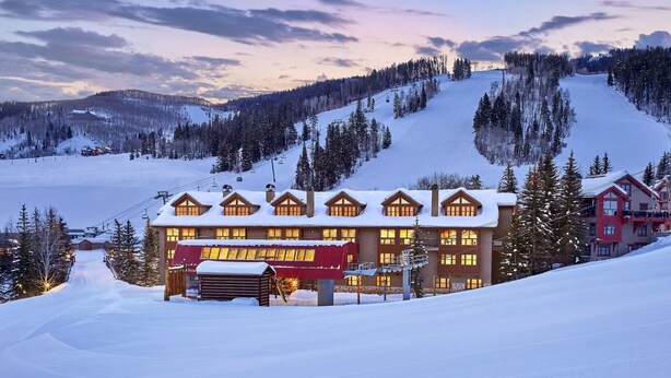 A large lodge with multiple windows and a ski lift in the background. - Immediate ⛷ In/out,  🏔 views,  walk 2 village, PERFECT location, OFP, Pool&HotT (Avon)