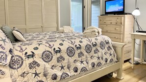 A bedroom with a bed, a dresser, a TV, and a lamp. - Sunny St Andrews Common, Palmetto Dunes, 1st Floor 2Bed/2Ba, 2 Bikes, Near Pool (Hilton Head Island)
