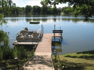 Western exposure with beautiful sunsets, level lot, swimming raft and boats!