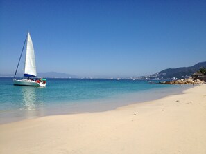 On the beach, sun-loungers, beach towels