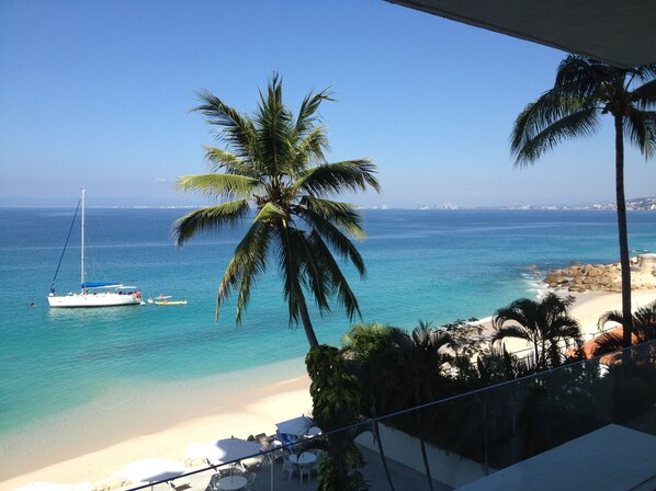 On the beach, sun loungers, beach towels