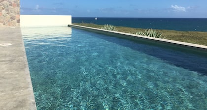 Modern Oceanfront Home with Pool, Outdoor Showers and Private Tennis Court